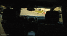 a man is jumping in the air while sitting in a car with imgflip.com at the bottom