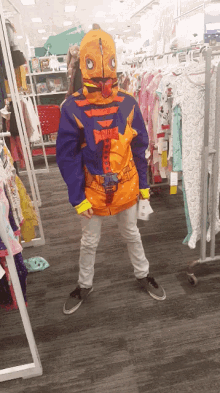 a child in a costume standing in a store