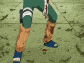 a cartoon character with blood on his leg is standing on the ground