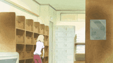 a girl in a white shirt and red pants is standing in front of a row of lockers