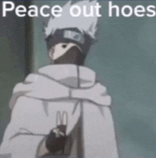 a cartoon character is standing in front of a wall with the words `` peace out hoes '' on it .
