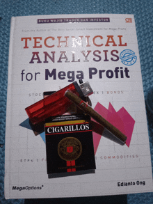 a pack of cigarillos sits on top of a book called technical analysis for mega profit