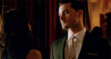 Enzo And Bonnie Fixing His Tie Enzo And Bonnie Bennett GIF - Enzo And Bonnie Fixing His Tie Enzo And Bonnie Bennett Enzo St John GIFs
