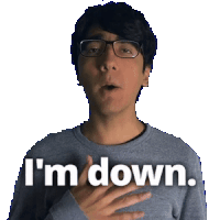 a man wearing glasses says i 'm down with his hand on his chest