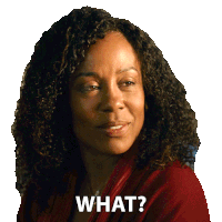 a woman with curly hair has the words what written on her face