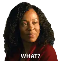 a woman with curly hair has the words what written on her face