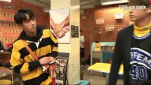 a man wearing a black and yellow striped jacket with the number 40 on it