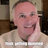 a man with his hand on his face and the words yeah getting dommel on the bottom