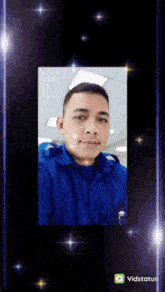 a video of a man in a blue shirt is displayed on a screen