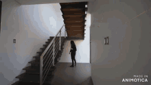 a woman is standing on a set of stairs made by animatica