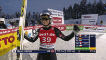 a skier wearing a red jersey with 39 on it