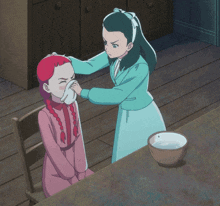 a girl with red hair wipes her nose with a cloth