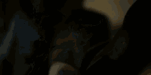 a person is laying on a bed with their arms outstretched .