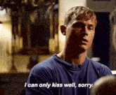 a man in a blue shirt is talking to another man and says `` i can only kiss well , sorry . ''