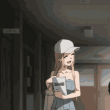 a girl in a white baseball cap is holding a book that says ' dragon ball z ' on it
