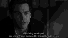 a black and white photo of a man with a quote that says i like being a sociopath