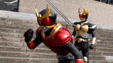 two kamen riders are walking down a set of stairs .