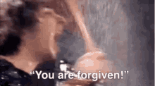 a man is screaming in the rain and saying `` you are forgiven ! ''