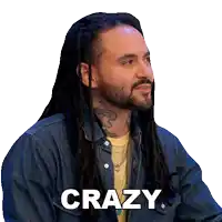 a man with dreadlocks and a beard has the word crazy on his face