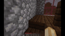 a screenshot of a minecraft game shows a wooden floor and a wall