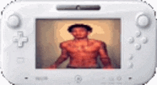 a white video game controller with a picture of a shirtless man on it .
