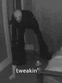 a black and white photo of a person with the word tweakin written on the bottom