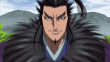 a man with long black hair and a beard