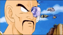 a bald man with a mustache is looking at a helicopter
