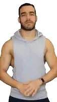a man wearing a grey tank top with a hood