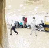 a group of people are dancing in a room with a sign that says exit on it