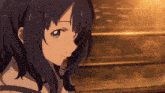 a close up of a girl 's face with a blurry background