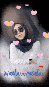a woman wearing a hijab and sunglasses is surrounded by pink hearts and the words waalaikum salam