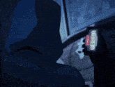 a person 's torso is shown in a dark room with a blue background