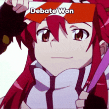 a girl with red hair holds up a sign that says debate won
