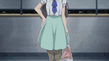 a girl in a white shirt and blue tie holds a bag