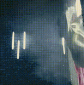 a person is standing in front of a screen that says ' ii ' on it