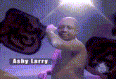 a statue of a baby with the name ashy larry on the bottom