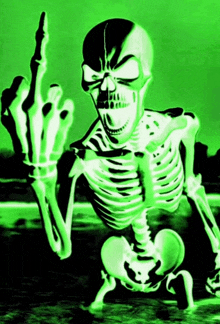 a skeleton giving the middle finger in green light