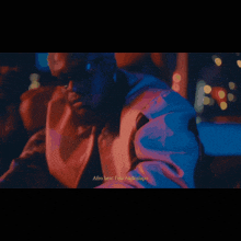 a man in a blue jacket says afro beat fola anakulapo