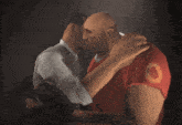 a man in a red shirt with the letter p on it is hugging another man