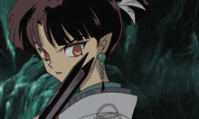 a girl with red eyes is holding a knife
