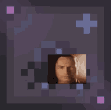 a pixelated image of a man 's face is surrounded by purple and blue squares