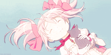 a girl with pink hair is laying down with a cat