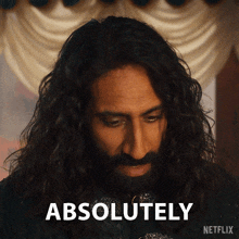 a man with long hair and a beard has the word absolutely above him