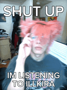 a man with pink hair has glasses on and says shut up im listening to illkira