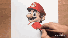 a person is drawing mario on a piece of paper with a pencil