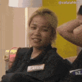 a woman with a name tag that says klarisse on it