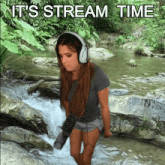 a woman wearing headphones is standing in a stream with the words it 's stream time