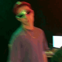 a blurry picture of a person wearing a hat and sunglasses