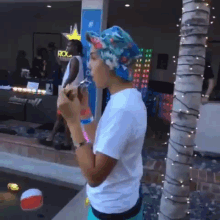 a woman eating ice cream in front of a store that says rockstar